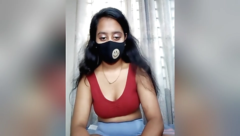 Sexy brunette solo female shows off her body in a sexy outfit