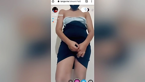 Hot brunette showing off her big tits and body in a tango