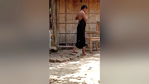 Amazing blonde woman with a nice ass stretches outdoors