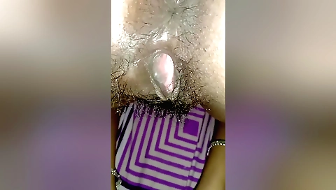 Indian girl with a hairy pussy shows off her pussy