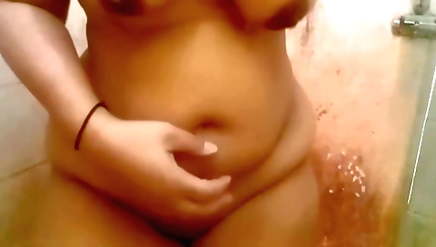Indian girl is naked in the shower in the shower room