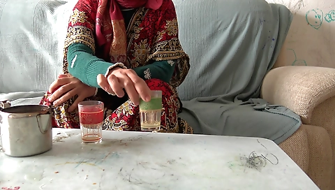 Indian chick in black turban and black dress in a video