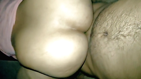 Indian wife standing with legs raised on the bathroom