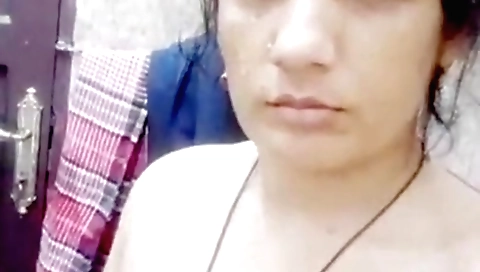 Indian brunette is playing with her big natural tits and pussy