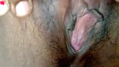 Hairy indian woman enjoys her hairy pussy in amateur video