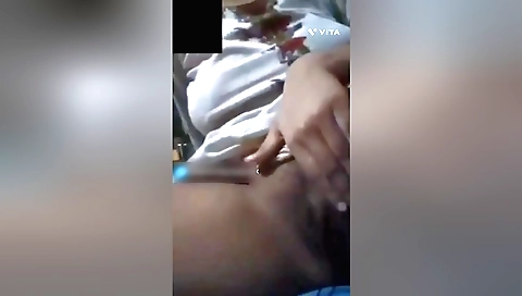 Busty brunette is playing with her hairy pussy on the webcam