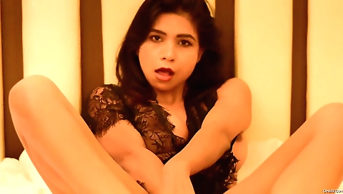 Sexy brunette plays alone on her bed in hot solo video