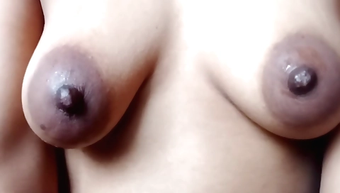 Busty chick in red dress and black stockings enjoys a blowjob