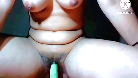 Indian girl uses a dildo to fuck herself in a solo video