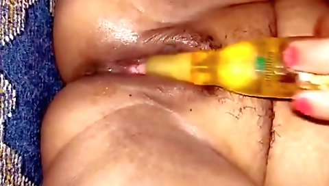 Indian hottie gets her hairy pussy filled with a dildo