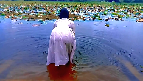 Solo girl is getting naked and naked in the summer outside