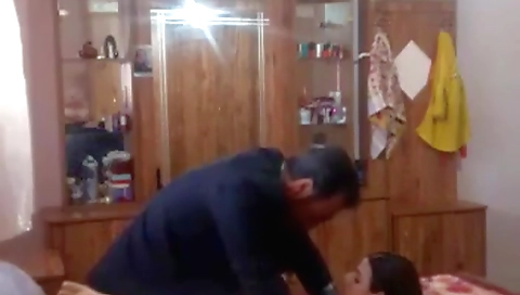 Brunette in a black dress is fucked in a hidden cam