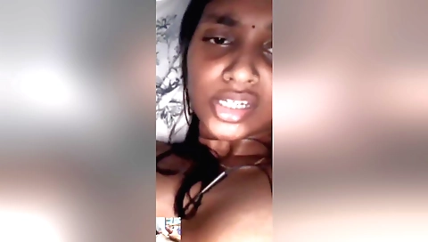 Amateur girl fingers a hairy pussy in solo movie clip