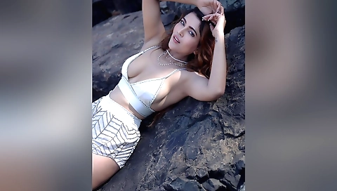 Hot brunette is having beach sex with two strangers