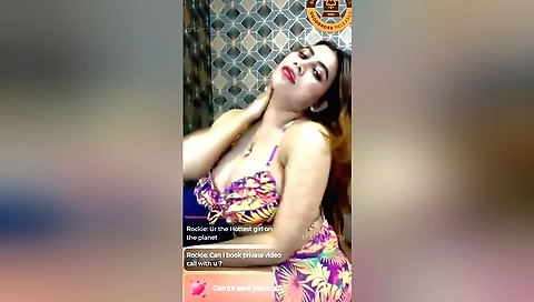 Sexy brunette shows off her big tits on the webcam