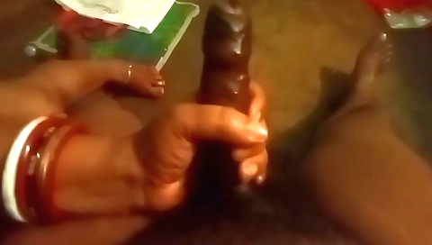 Handjob with a big black cock by a nice black woman